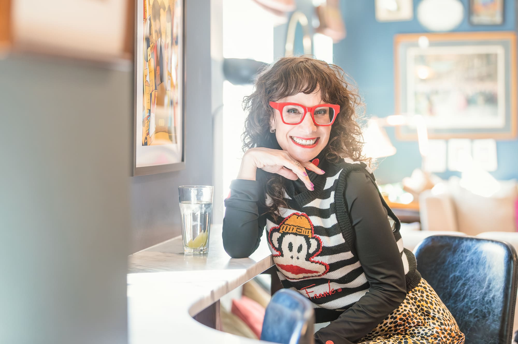 Shari Teigman smiling at a café table