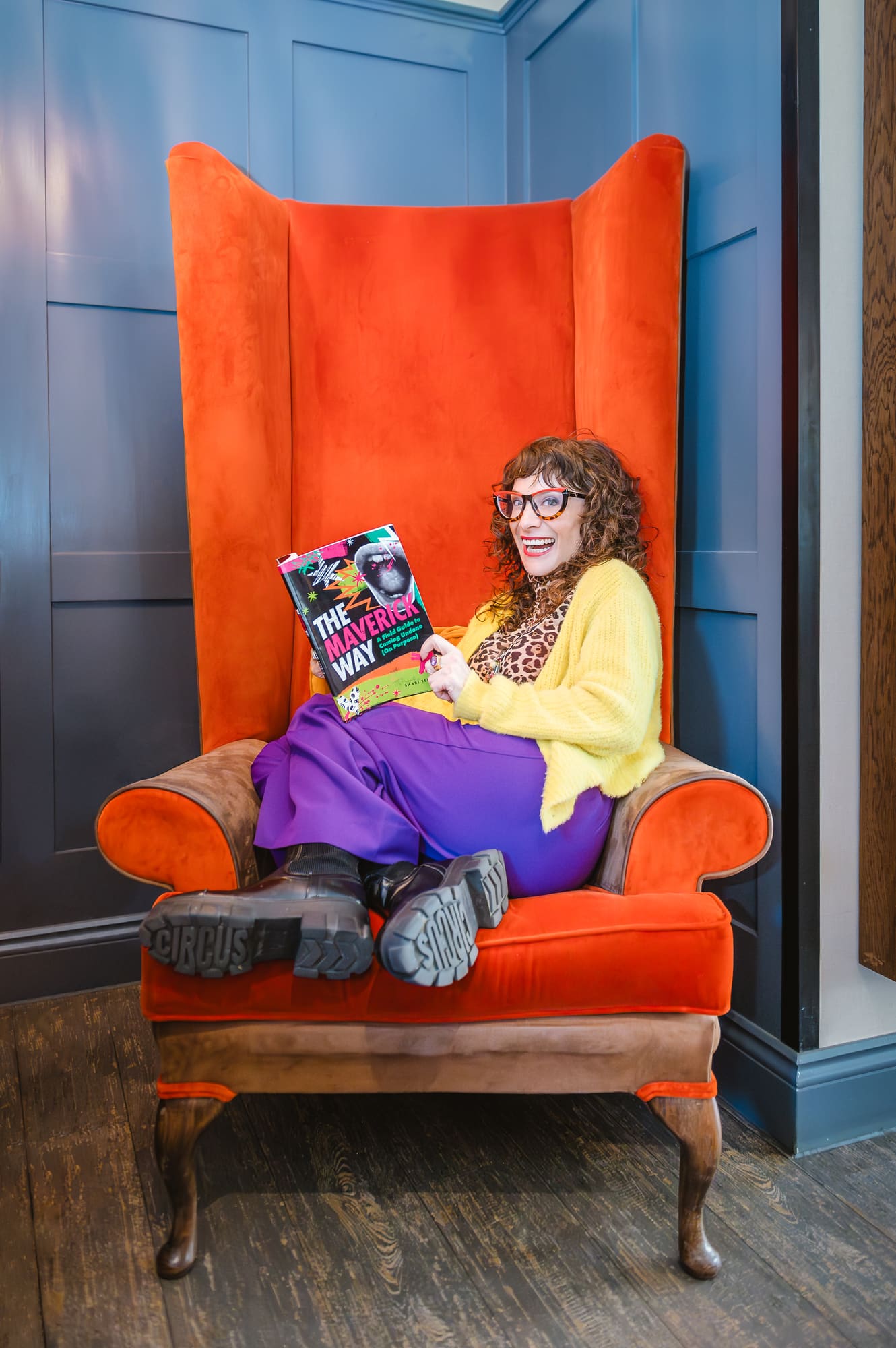 Shari Teigman holding The Maverick Way